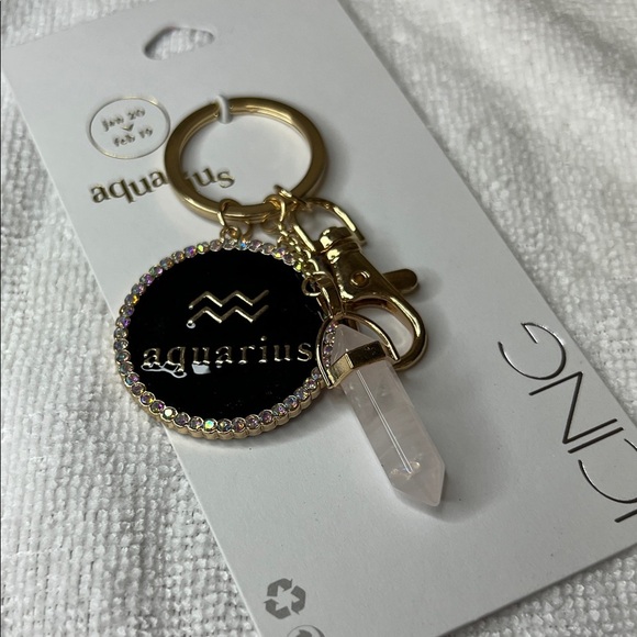 Icing Aquarius Keychain with Black and Gold Accents - Picture 2 of 5
